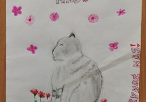 Autorzy: Antonina Kondusz i Maja Bobka z kl. 6 c Praca przedstawia szczęśliwego kociaka. Obraz zdobią liczne kwiaty oraz napisy „Dbaj o nas!” i „Nie krzywdź nas”.